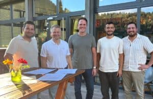 Five representatives at the Vinova contract signing.