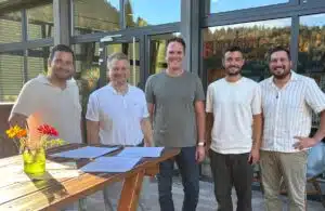 Five representatives at the Vinova contract signing.