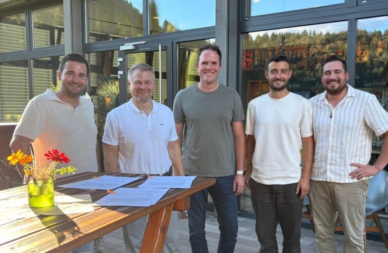 Five representatives at the Vinova contract signing.