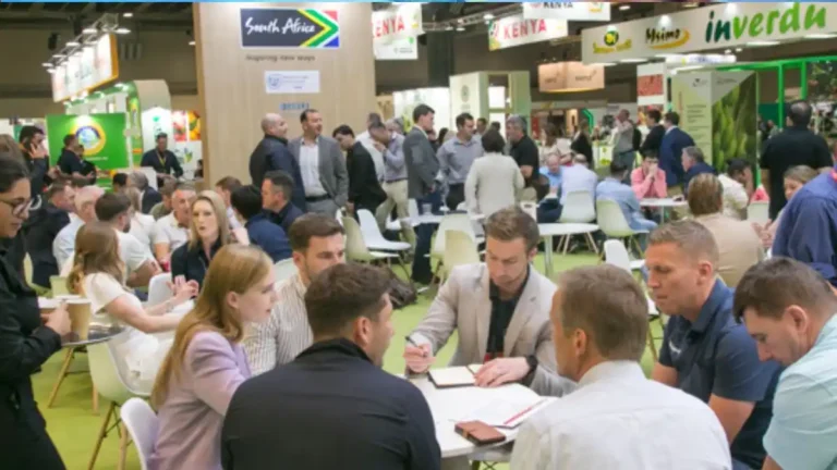 Fresh produce buyers and suppliers meeting on a trade show floor