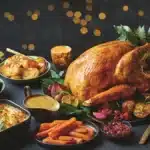 Roast turkey with potatoes, Brussels sprouts, carrots and gravy on a festive table