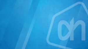 White Albert Heijn logo on a textured blue background