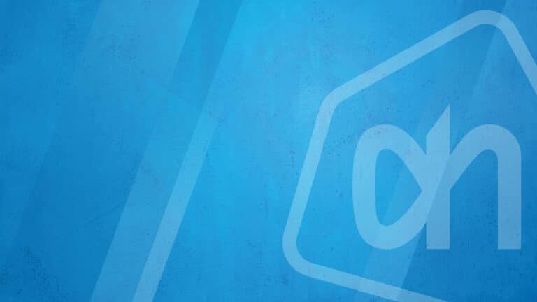 White Albert Heijn logo on a textured blue background