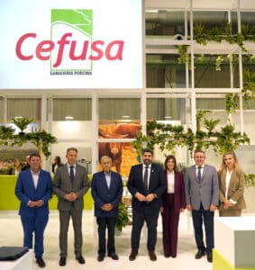Seven people standing beneath Cefusa signage at an exhibition stand