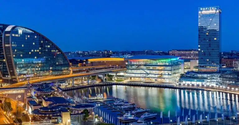 ICC Sydney and surrounding Darling Harbour buildings at dusk.
