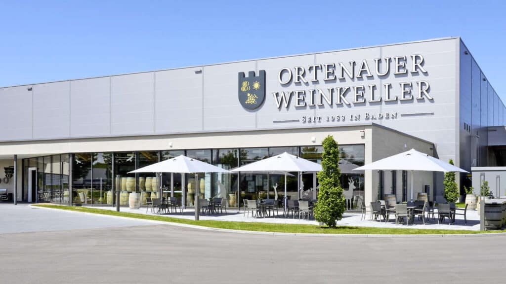 Ortenauer Weinkeller building with white umbrellas and outdoor seating
