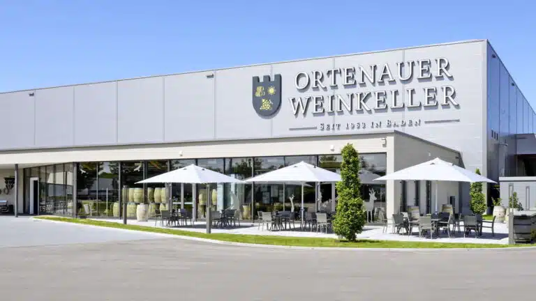 Ortenauer Weinkeller building with white umbrellas and outdoor seating