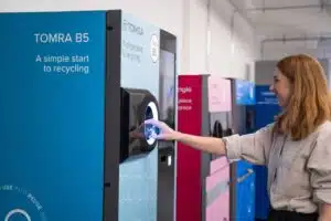 Customer using a TOMRA B5 reverse vending machine
