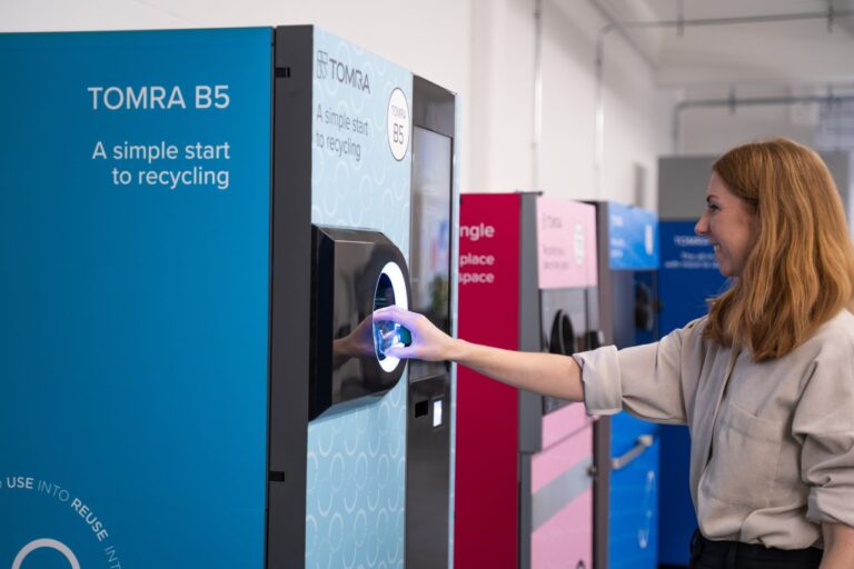 Customer using a TOMRA B5 reverse vending machine
