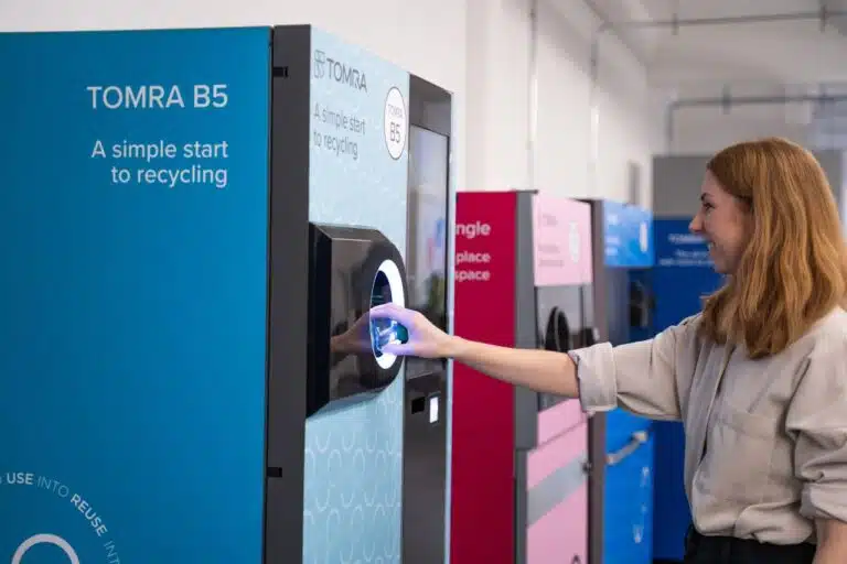 Customer using a TOMRA B5 reverse vending machine
